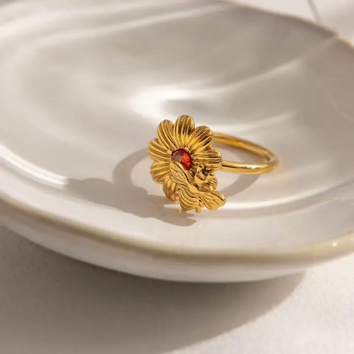 Bague Zora Fashion en forme de marguerite sertie de zircon rouge pour femmes