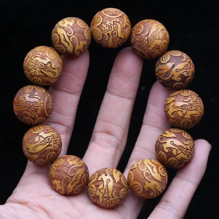 Bracelet en bois naturel sculpté dieu bête richesse