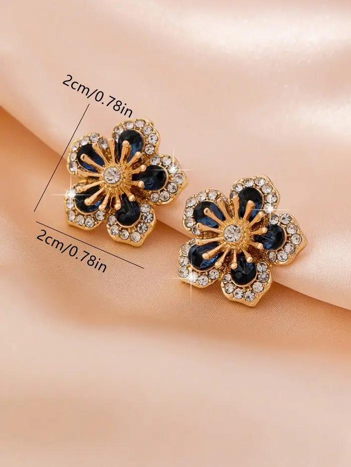 Une paire de boucles d'oreilles florales pour femmes