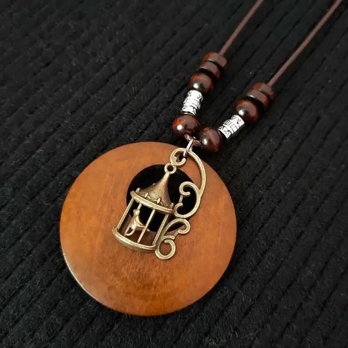 Collier en bois de style ethnique vintage avec pendentif perlé