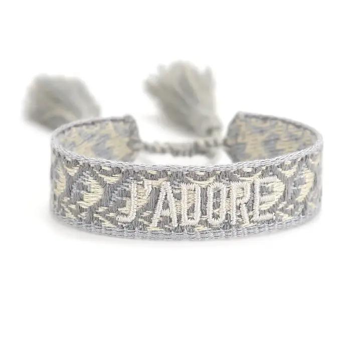Bracelet personnalisable en tissu brodé avec pompon réglable pour l'amitié et les fêtes