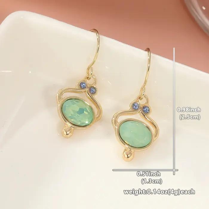 Boucles d'oreilles ovales classiques en or incrusté de pierres vertes pour femmes