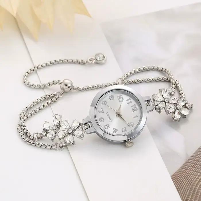 Montre-bracelet femme élégante à quartz avec motif fleurs boîtier métal et boucle bijoux pour style luxe affaires et sport