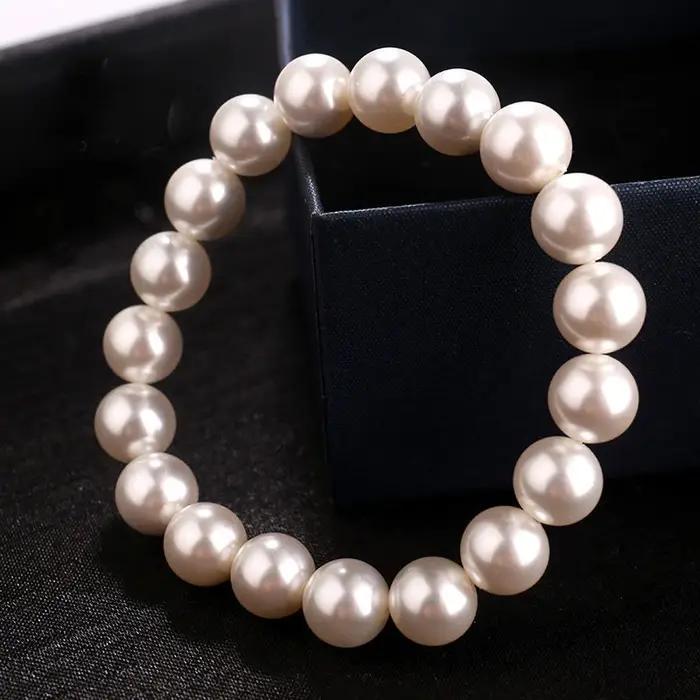 Bracelet classique élégant en perles blanches élastiques pour femmes et hommes