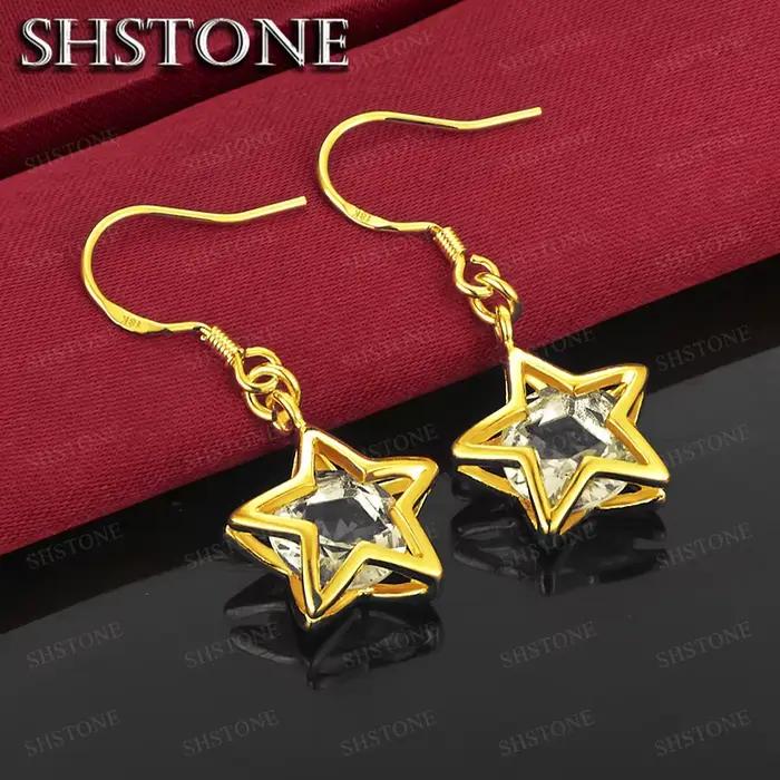 Boucles d'oreilles classiques en or 18 carats avec cristal en forme d'étoile pour femme