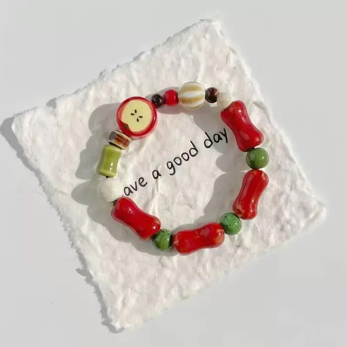 Bracelet en céramique de perles d'os de fruits multicolores fait à la main pour femmes, extensible, bijoux ethniques Boho pour occasions spéciales