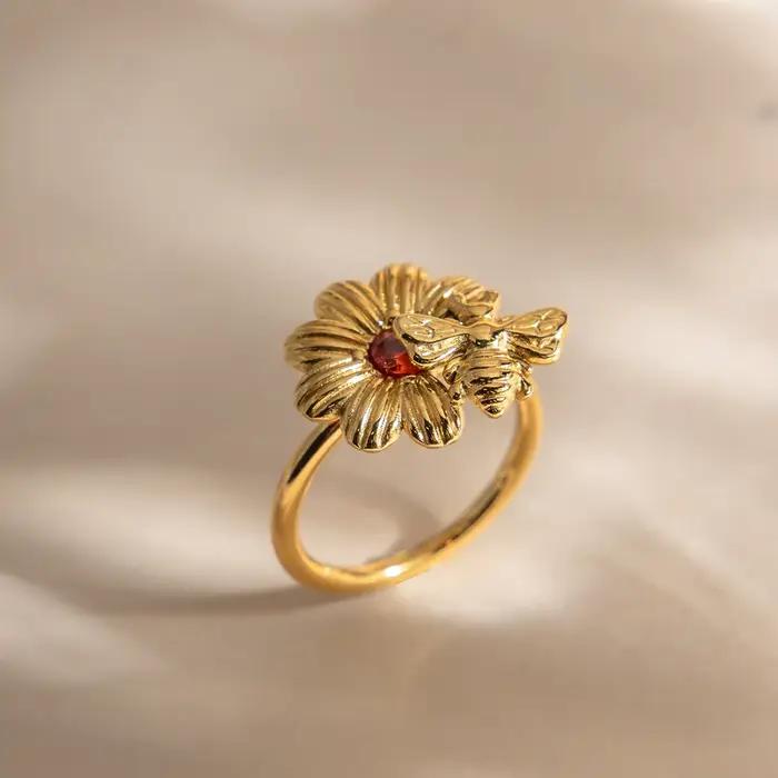 Bague Zora Fashion en forme de marguerite sertie de zircon rouge pour femmes