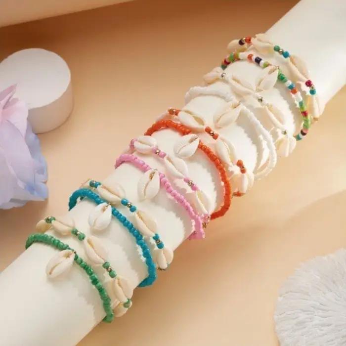 Chevillères en coquillages naturels avec perles en résine pour femmes, chaînes de cheville pieds nus pour été et plage, bijoux de pied élégants et originaux