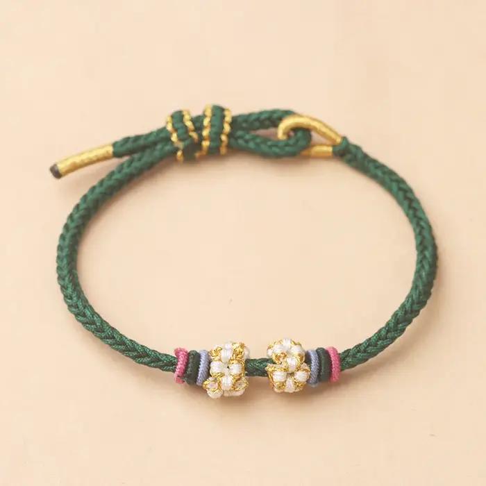 Bracelet ajustable tressé à la main motif fleur de pêcher nylon cordon perlé à huit brins pour femmes occasions spéciales DIY bijoux