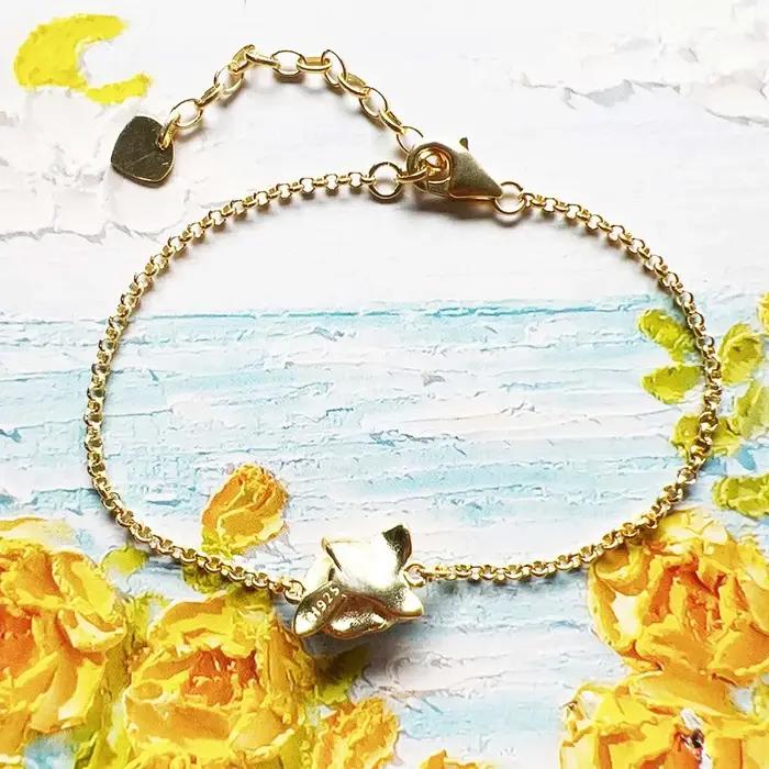 Bracelet doré à fleur de Rose