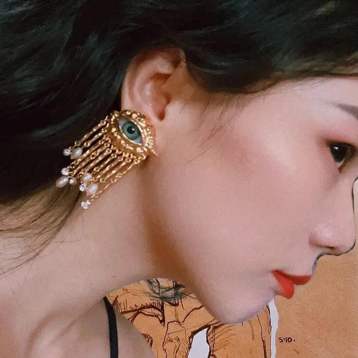 Boucles d'oreilles avec pompon en biscuits perlé pour femmes