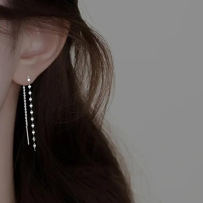 Boucles d'oreilles pendantes torsadées à sequins géométriques couleur argent pour femmes