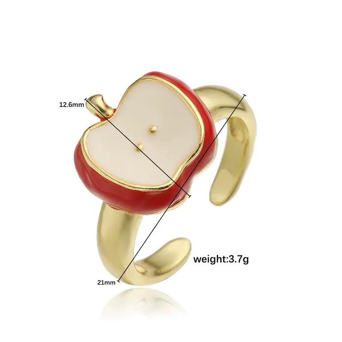 Bague en laiton plaquée or 18 carats avec pomme rouge émaillée ajustable pour femmes occasions générales style moderne bijou unique