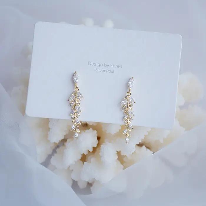 Boucles d'oreilles à breloques en feuilles d'or véritable 18 carats pour femmes