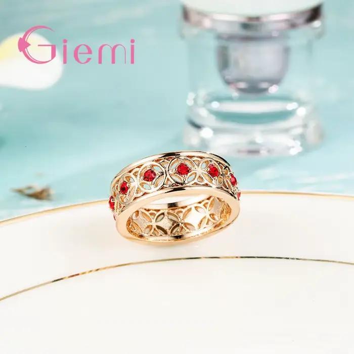Bague centrale en cristal rouge incrusté creux pour femmes, couleur or Rose de haute qualité, bijoux à la mode, cadeau de fête d'anniversaire pour filles heureuses