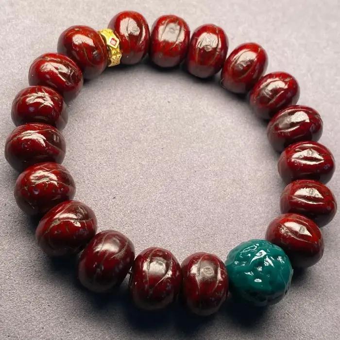 Bracelet tibétain en œil de phénix rouge de 14mm