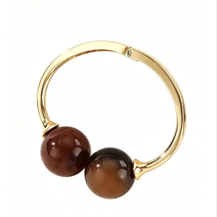Bracelet en acrylique ouvert avec perles doubles sphériques