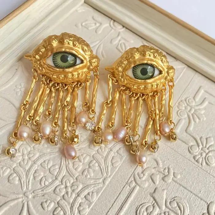 Boucles d'oreilles avec pompon en biscuits perlé pour femmes
