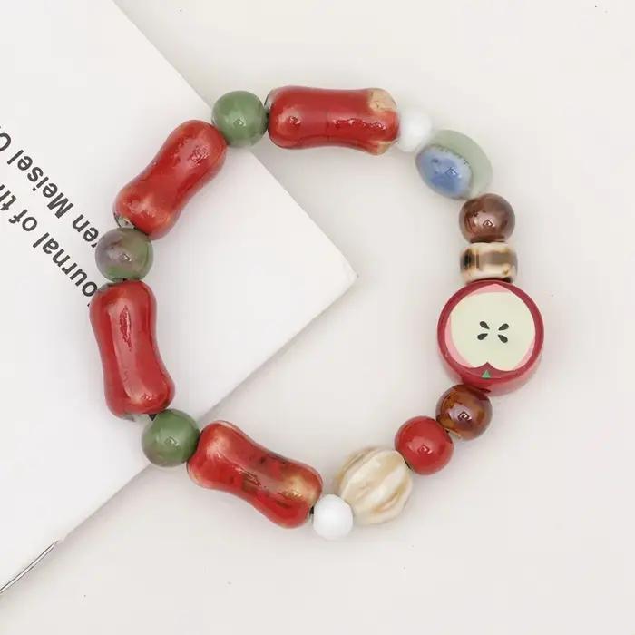 Bracelet de perles de pomme en céramique rouge Dopamine