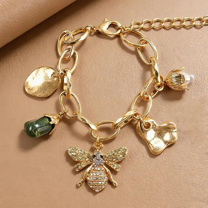Bracelet à breloques abeille botanique