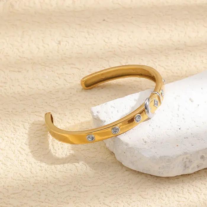 E.B.belle Bracelet fin pour femme en acier inoxydable doré 18 carats avec boucle argentée et zircon