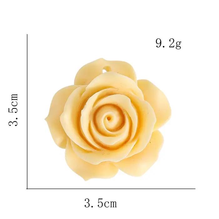 Pendentif rose en bois de fruits ivoire naturel