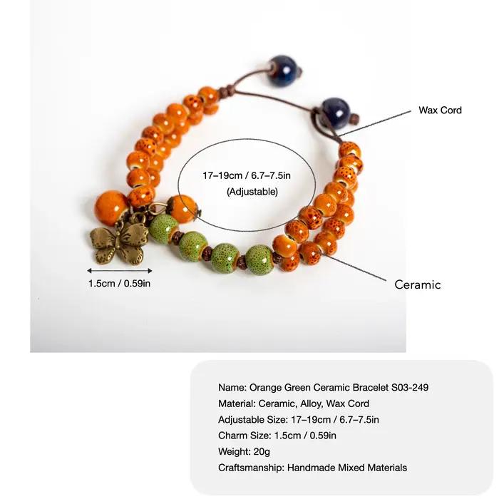 Bracelet en céramique vert-orange avec breloque papillon