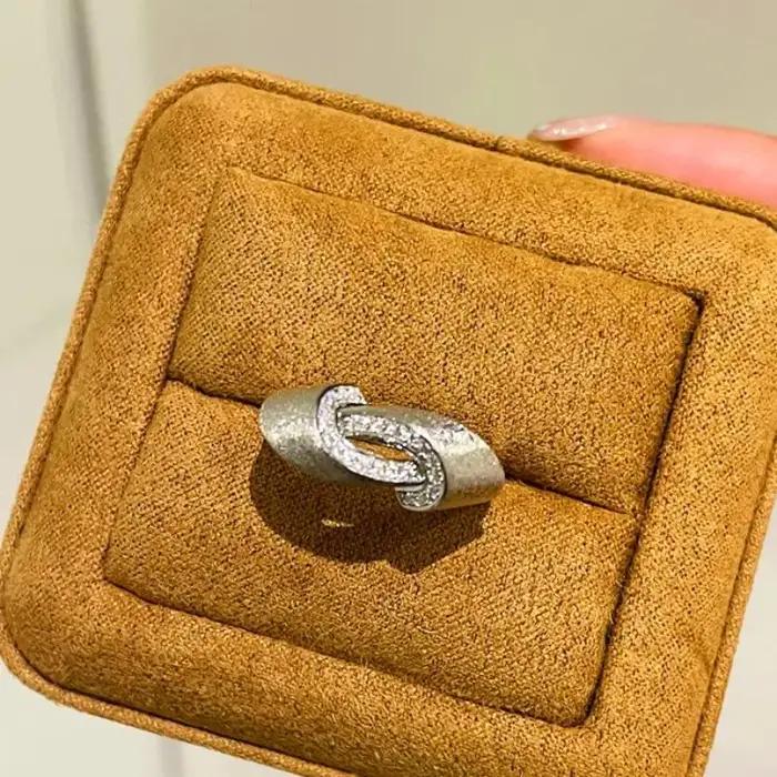 Bague Vintage Entrelacée en Plaquage Argent Sertie de Zirconium Blanc pour Femmes Occasions Spéciales Bague de Cocktail Infinie Möbius