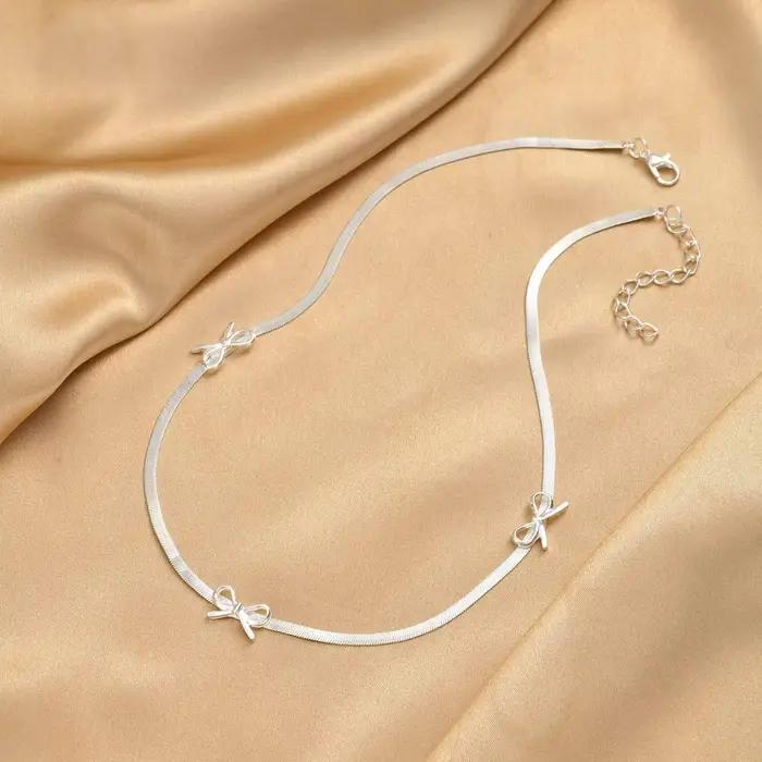 Bracelet Nœud Papillon Argenté avec Chaîne Serpent et Ruban
