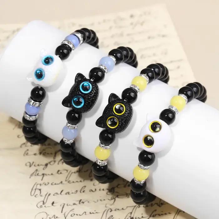 Couple de chat de dessin animé brillant avec paire de bracelets