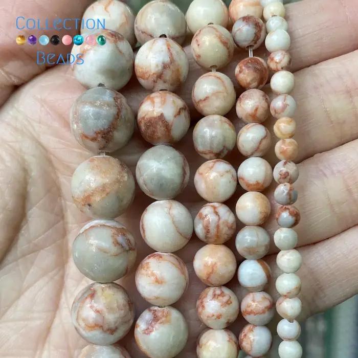 Perles rondes en Rhodonite de toile rouge naturelle