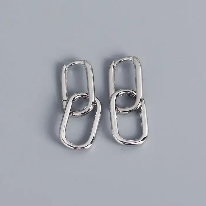 Boucles d'oreilles pendantes couleur or avec décor en Zircon brillant
