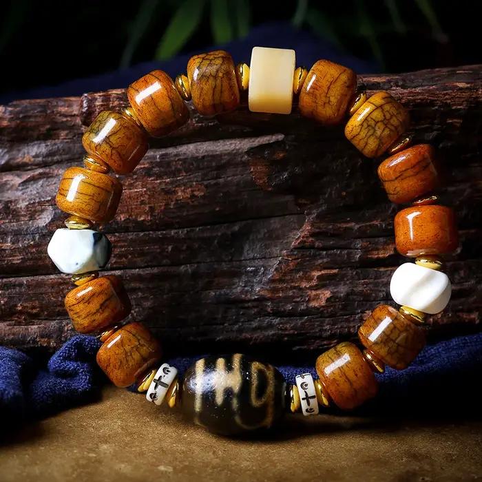 Bracelet ethnique en perles de baril craquelées en os de yak tibétain avec perle Dzi