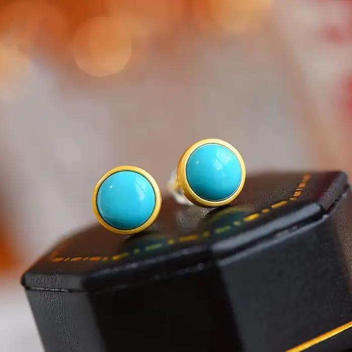 Boucles d'oreilles rondes turquoises incrustées en argent