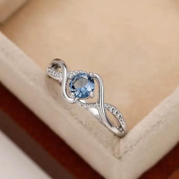 Alliance de mariage Huitan en laiton avec zircone cubique bleue, moderne et élégante pour mariage et anniversaire de mariage