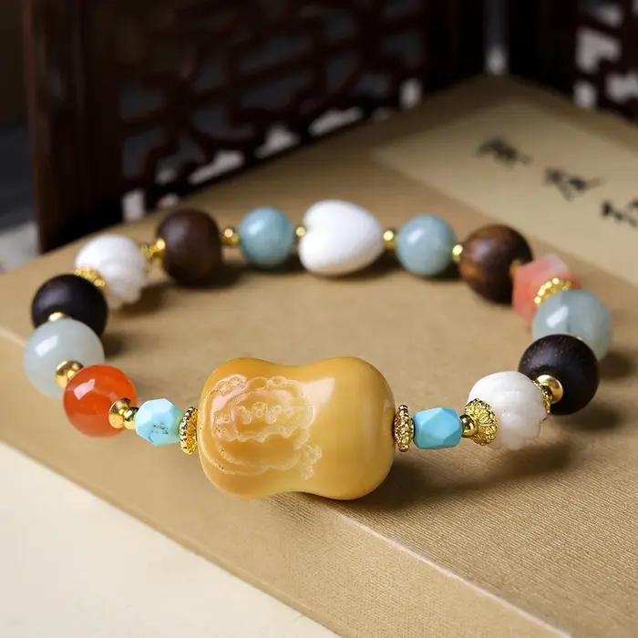 Bracelet en noix de tagua brûlée au charbon avec cœur en corne