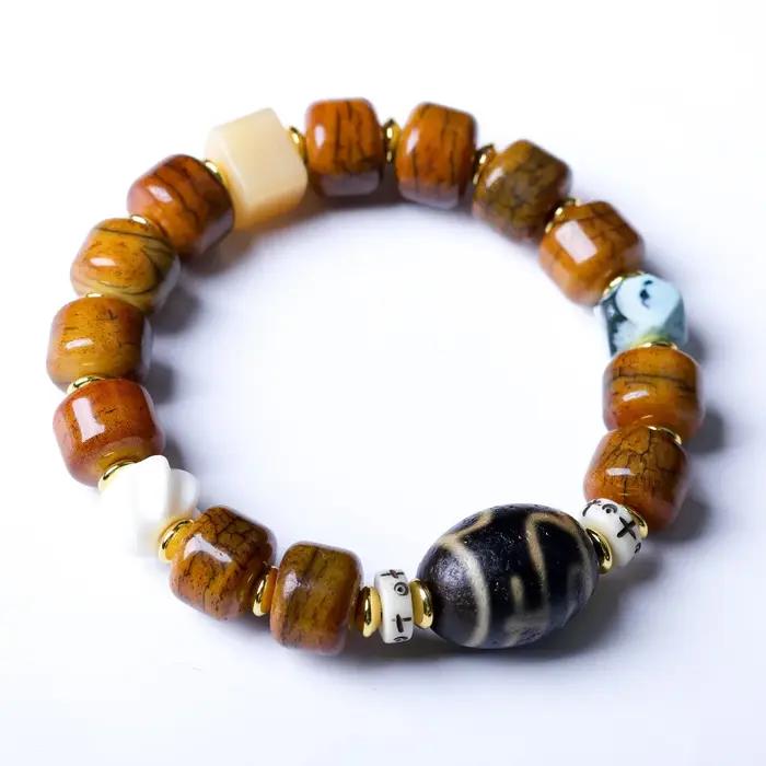 Bracelet ethnique en perles de baril craquelées en os de yak tibétain avec perle Dzi