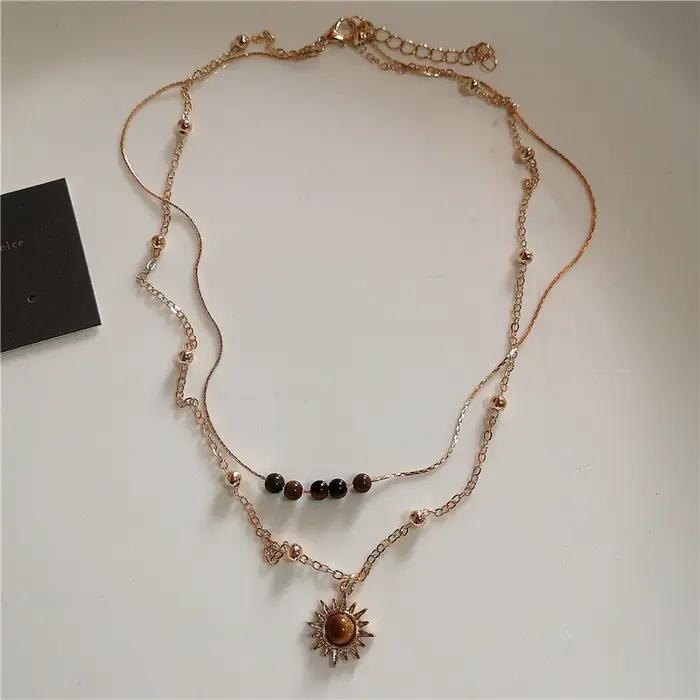 Collier Vintage en cuir avec pendentif soleil en pierre marron