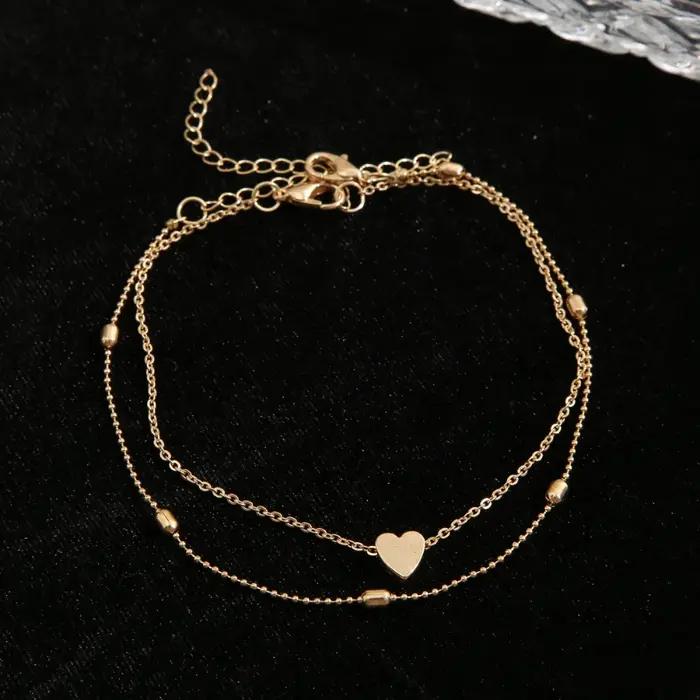 Bracelet de cheville en forme de cœur élégant pour femmes, bijou de cheville en métal or rouge à porter pour diverses occasions spéciales
