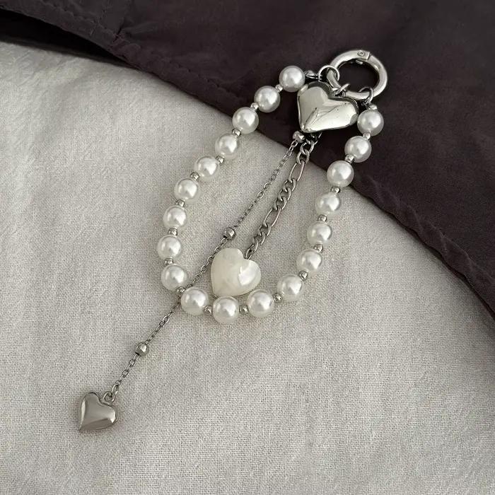 Nouveau porte-clés chaîne de perles 2025 nouveau coeur de pêche perle sac chaîne pendentif bijoux ac