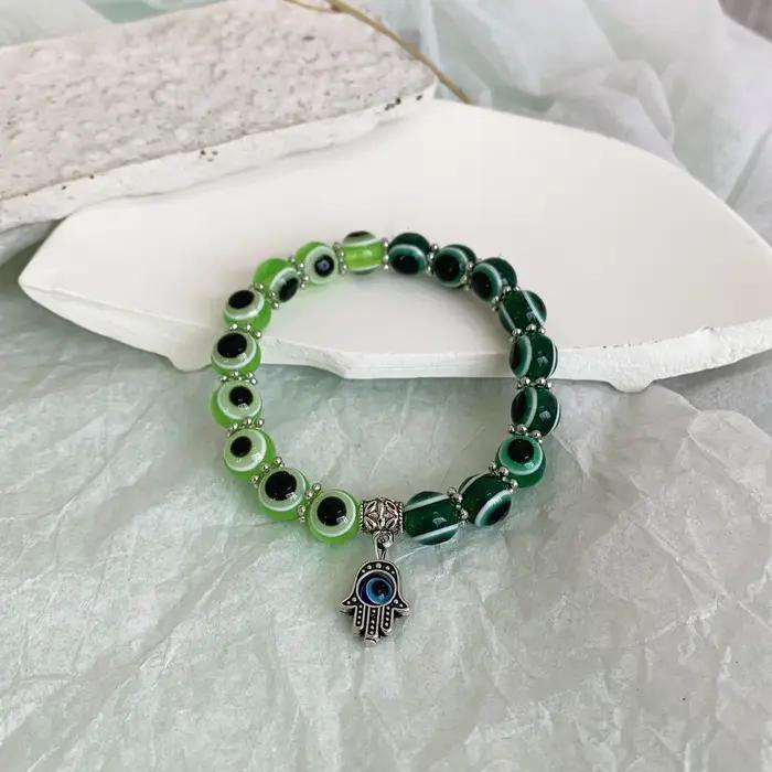 Bracelet mauvais œil bleu main de Fatima dinde mille yeux souhait fait