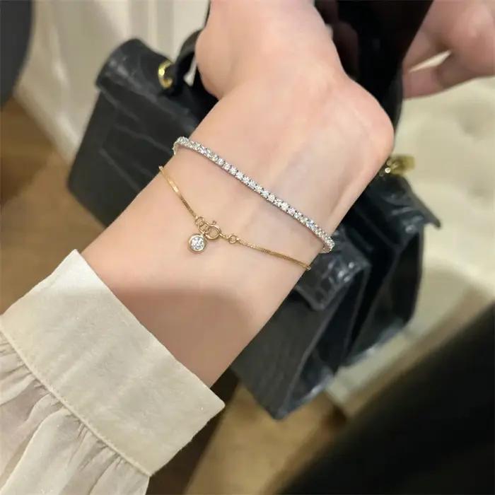 Bracelet de luxe en acier inoxydable pour femmes avec breloque en zircon pour les soirées et cadeaux d'anniversaire