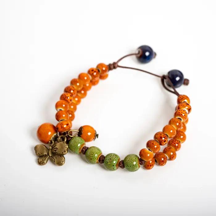 Bracelet en céramique vert-orange avec breloque papillon, bijoux perlés faits à la main, style vinta