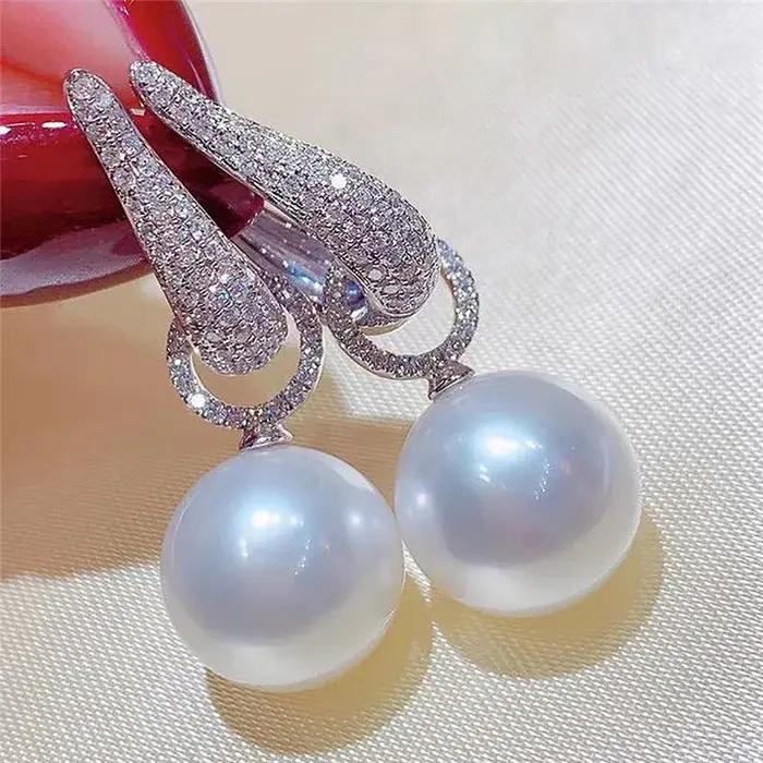 Boucles d'oreilles pendantes en perles pour femmes, bijoux de luxe en zircone cubique scintillante,