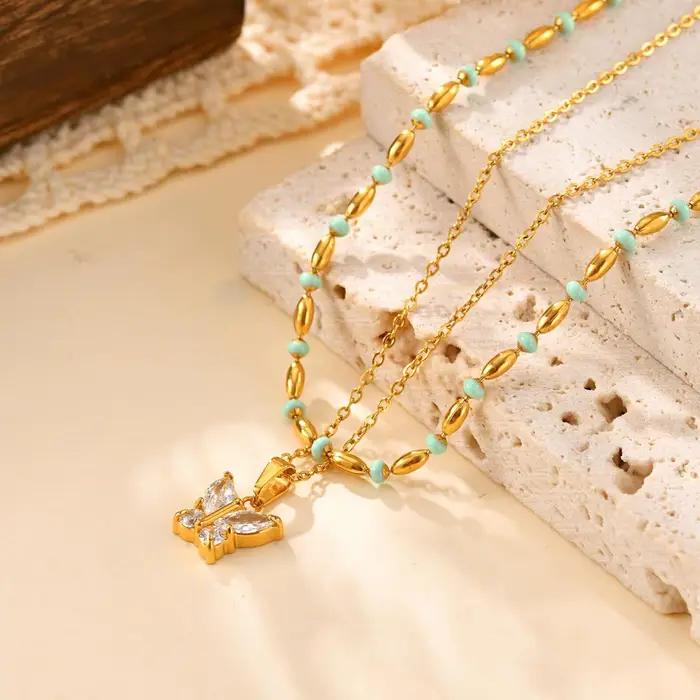 Collier en forme de papillon serti de zircone cubique plaqué or pour femmes occasions spéciales partys et mariages