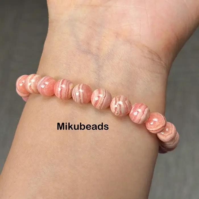 Perles rondes lisses en rhodochrosite naturelle 8-11.5mm 3A