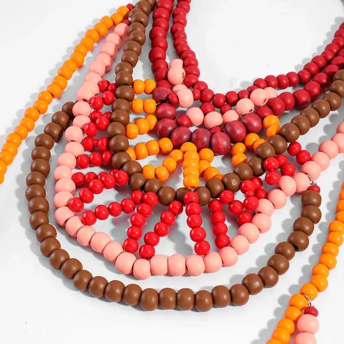 Collier bib bohème multicouche en perles de bois