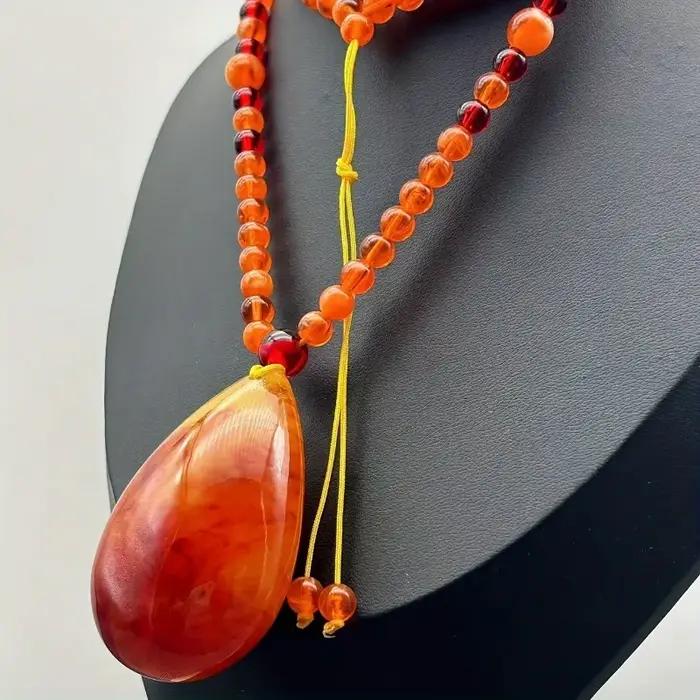 Collier pendentif goutte d'ambre, amulette porte-bonheur, élégant