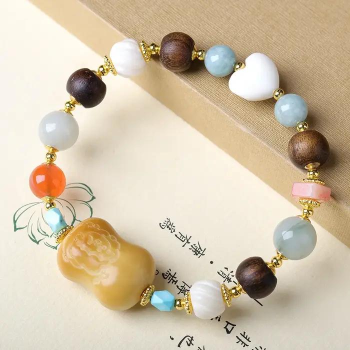 Bracelet en noix de tagua brûlée au charbon avec cœur en corne, agate rouge du Sud, jaspe de Tiansha