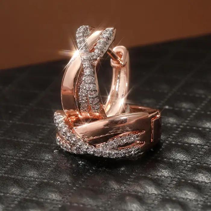 Boucles d'oreilles créoles torsadées en or rose